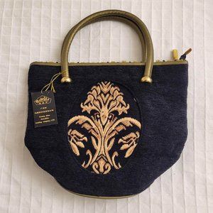 Malisha black and gold satchel.